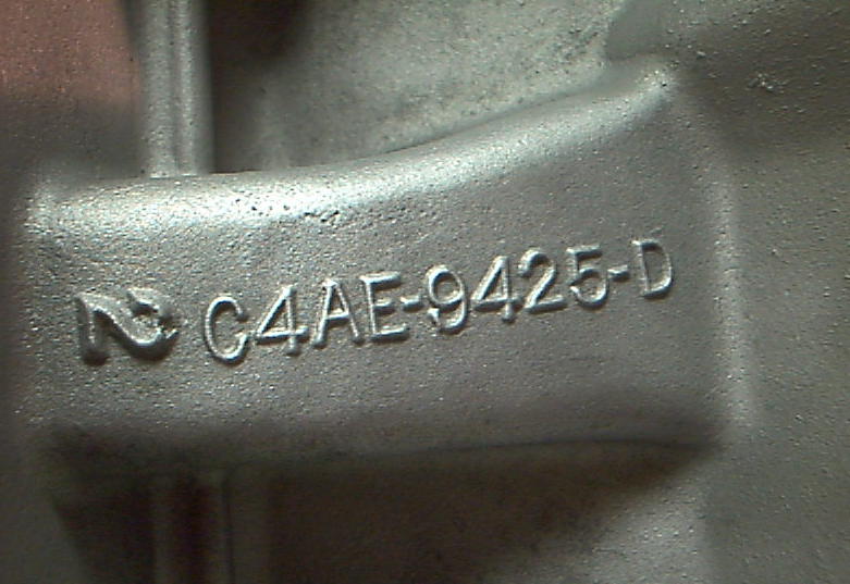 Close-up of a metal casting with "C4AE-9425-D" stamped on it