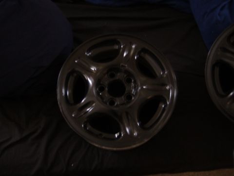 1998 Ford Taurus - A single car wheel is shown in detail, with another wheel partially visible to the right.
