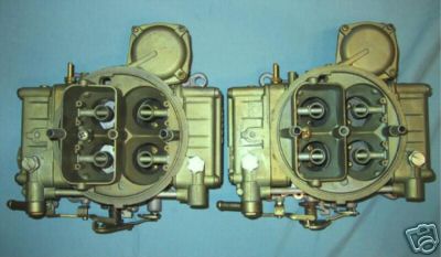1964 Ford Fairlane - A pair of carburetors are shown against a plain background. The website Supermotors.net is visible at the bottom.