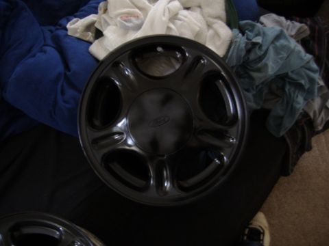 1998 Ford Taurus - This is a wheel cover, not a full vehicle. The Ford logo is visible.