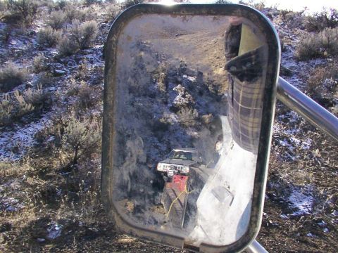 1978 Ford Bronco - Side mirror reflects a landscape scene with trees and sky.