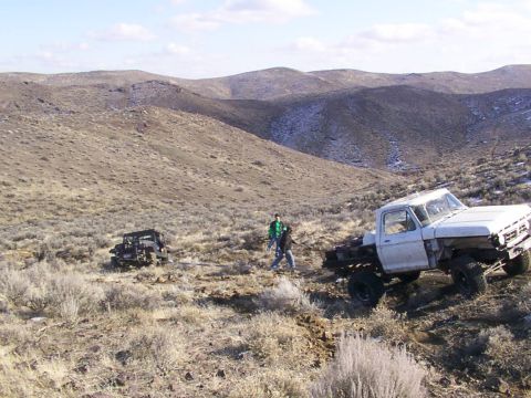 1978 Ford Bronco - A 1978 Ford Bronco is seen from a distance in a dry, hilly terrain.