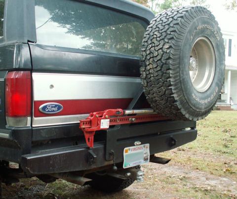 1988 Ford Bronco - Close-up view of the rear bumper and spare tire assembly on a vehicle.