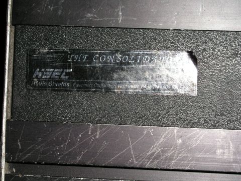 1999 Ford Crown Victoria - A close-up shows a label on a Havis Shields equipment console with company and location details.