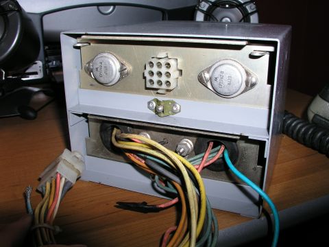 1999 Ford Crown Victoria - Close-up view of an electronic device's internal components, including transistors and wiring, with a SuperMotors watermark visible.