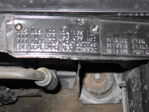 1991 Ford LTD Crown Victoria - close view of a stamped metal fender tag carrying rows of option codes and the words SPECIAL PAINT and SPECIAL ORDER.