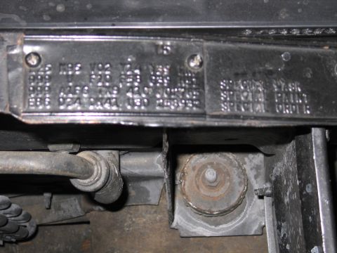 1991 Ford LTD Crown Victoria - stamped metal fender tag mounted in an engine bay showing rows of option codes and the words SPECIAL PAINT and SPECIAL ORDER.