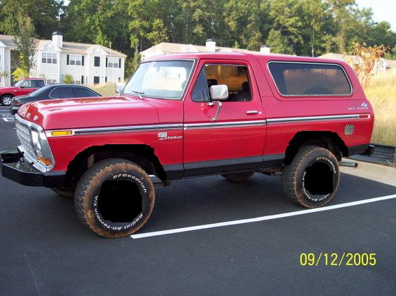 Red Ford Bronco parked in lot. Has BFGoodrich tires
