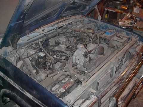 1990 Ford C-350 (Centurion Conversions) - Engine bay of a 1990 Ford C-350 (Centurion Conversions) with the hood open.