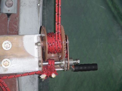 1993 Ford C-350 (Centurion Conversions) - A hoist mechanism with a coiled red rope and a black handle is visible.