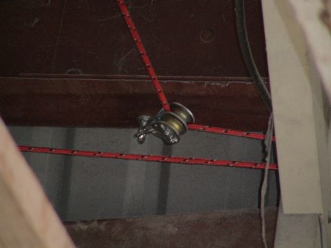 1993 Ford C-350 (Centurion Conversions) - A close-up view of a pulley system and red rope, likely part of a hoist mechanism.