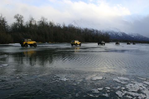 2003 Jeep TJ - Several Jeeps traverse a frozen landscape near Knik Glacier in February 2006.