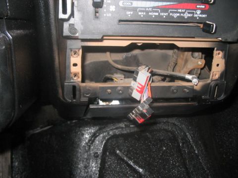 1991 Ford Bronco - Dashboard wiring exposed after radio removal in a 1991 Ford Bronco.