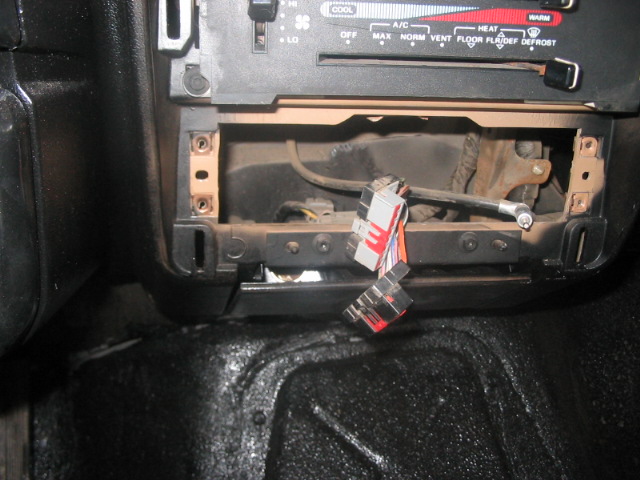 1991 Ford Bronco interior dashboard with radio removed, showing wiring harness