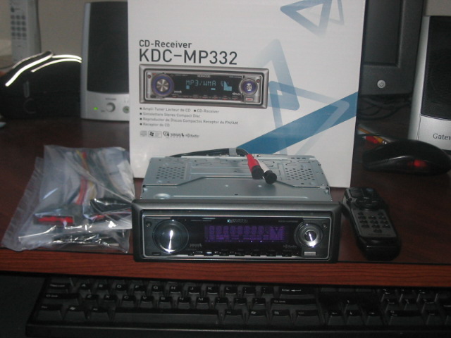 car stereo with wires and remote, box in background