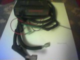 1993 Ford Probe - This photo shows an automotive wiring harness connected to a black control module with some red lettering visible.