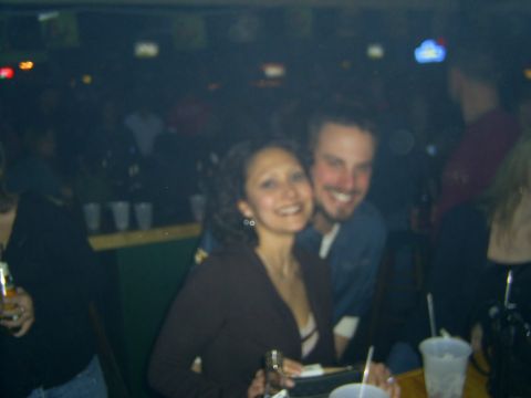 1977 Ford F-150 - A couple poses for a photo while at a bar with other patrons in the background.