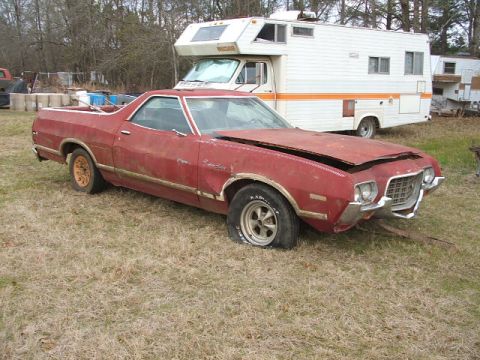 1966 Ford Ranchero - This red Ford Ranchero is in poor condition with a flat tire and open hood.