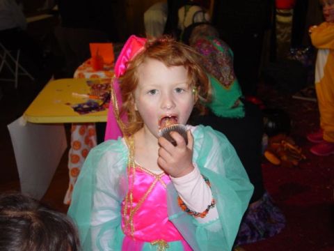 1986 Ford Bronco - A young girl dressed in a costume enjoys a cupcake at an event.