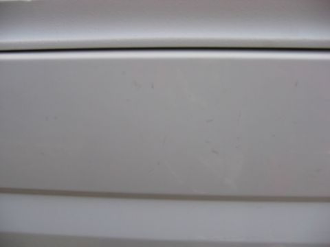 1995 Ford Bronco - Hard to see, but little scratches from the 1st owner. It said something along the lines of "Fire Chief"