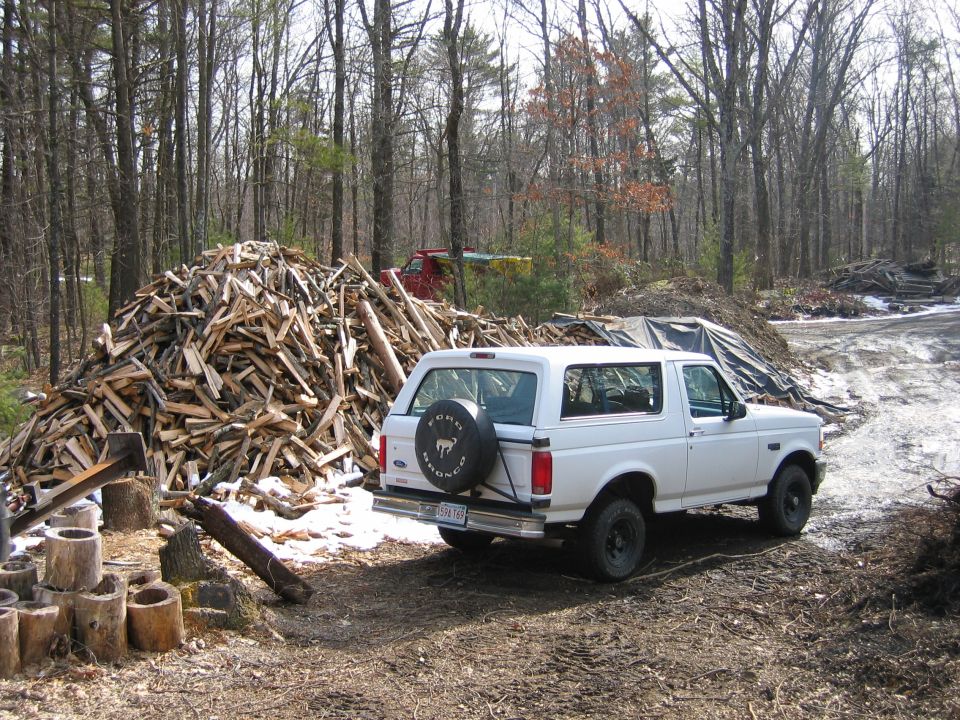 next to wood pile
95 F-350 (sand truck) in the background