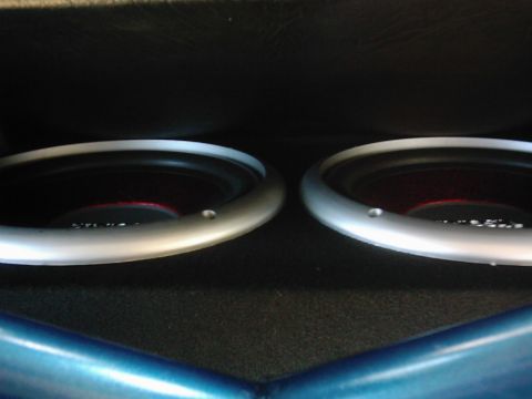 1978 Ford Bronco - Close-up of two subwoofers within a vehicle's audio system.