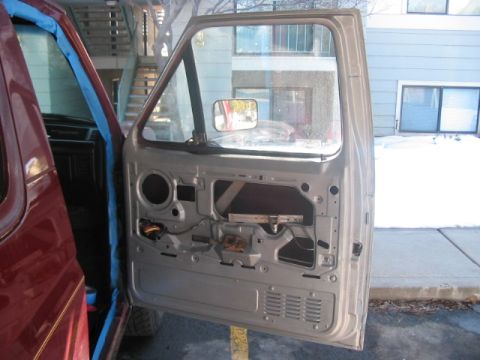 1991 Ford Bronco - Car door interior mechanism exposed, ready for repair or maintenance.