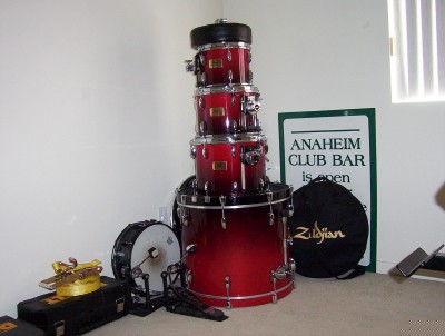 1995 Ford Bronco - A red drum set is shown with a Zildjian bag and a sign that reads 'Anaheim Club Bar is open'.