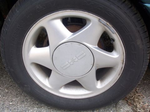 1993 Ford Taurus - This photo shows a vehicle's wheel and tire, not a 1993 Ford Taurus.
