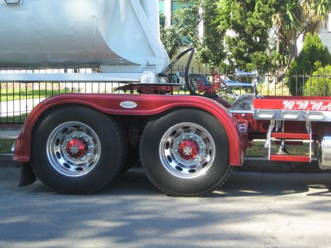 1968 Ford Mustang - Side view of a red Peterbilt truck chrome wheels and a large dump trailer.