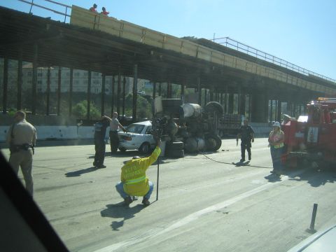 1968 Ford Mustang - Accident scene with an overturned semi-truck and a car, under an overpass construction zone.