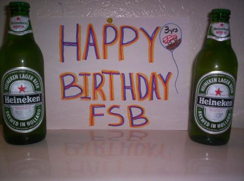 1989 Ford Bronco - A birthday sign with a drawing of a toy truck and two bottles of Heineken beer.