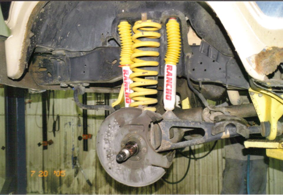 Front suspension with yellow Rancho shocks and springs. Date stamp '7 20 '05'