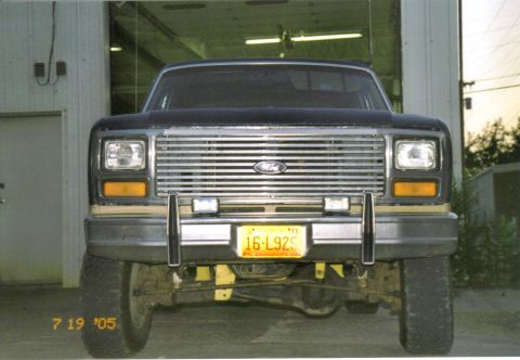 1986 Ford Bronco - Front view of a 1986 Ford Bronco, showing its grille and headlights.