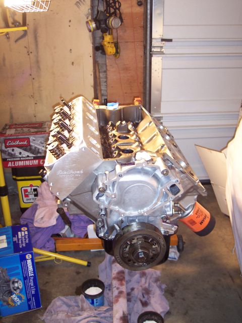 1981 Ford Bronco - Engine block assembly with Edelbrock valve covers and oil filter in a garage setting.