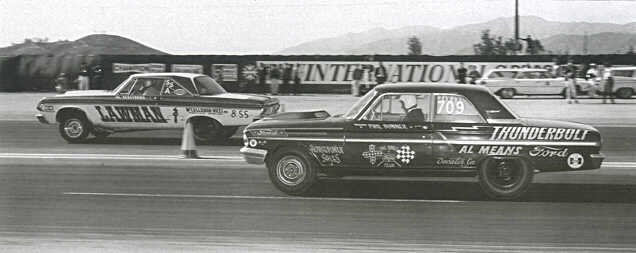 Black-and-white drag race photo of two 1960s Ford sedans, one lettered Thunderbolt