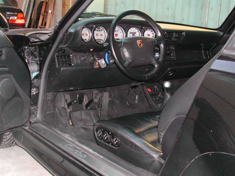 1997 Porsche 911 - Interior view of a 1997 Porsche 911 Turbo, highlighting the dashboard, steering wheel, and driver's seat.