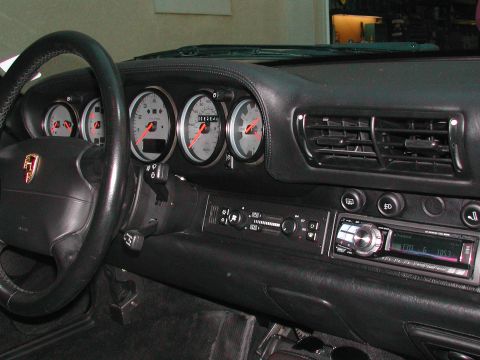 1997 Porsche 911 - Interior view of a 1997 Porsche 911 dashboard, showing gauges, steering wheel, and center console.