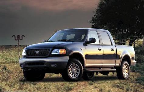 1999 Ford Crown Victoria - This 1999 Ford F-150 pickup truck is shown from a three-quarter front angle against a cloudy sky.