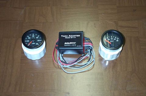 1998 Ford Crown Victoria - The tachometer, voltometer, and tach adapter.