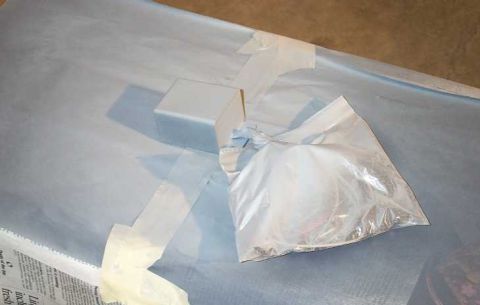1998 Ford Crown Victoria - Gauges are bagged and taped down on a surface covered with blue paper.
