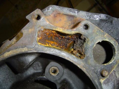 1979 Ford Bronco - This engine part shows significant corrosion and damage, indicating a need for repair or replacement.