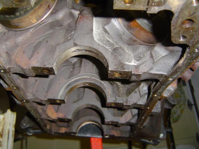 Engine block showing crankshaft bearing saddles and oil passages
