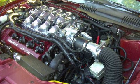 1997 Ford Taurus - Close-up view of a Yamaha 3.4L V6 DOHC engine, highlighting the intake manifold and valve covers.