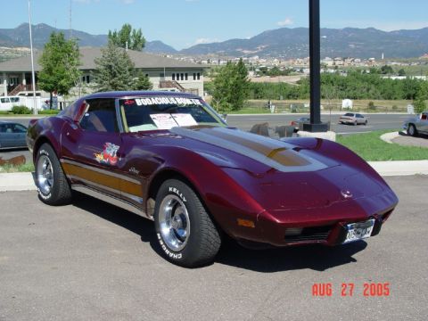 1972 Ford Ranchero - Maroon 1975 Chevrolet Corvette with gold stripe on hood and 'Bodacious' sticker on windshield.
