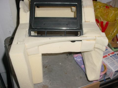1986 Ford Bronco - Custom center console modification project, a black trim piece and foam padding for shaping.