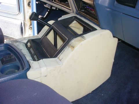 1986 Ford Bronco - Center console project underway, with foam shaping and component openings visible.