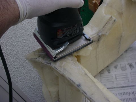 1986 Ford Bronco - Sanding a foam mold for a custom project, possibly for a vehicle's interior.