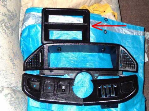 1991 Ford Bronco - A disassembled dashboard component is laid out on a blue tarp.