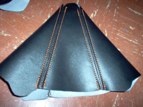 1994 Ford Probe - A black leather gear shift boot with orange stitching is shown from an overhead perspective.